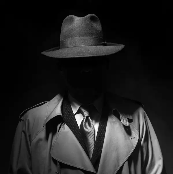 Investigator silhouette under street light